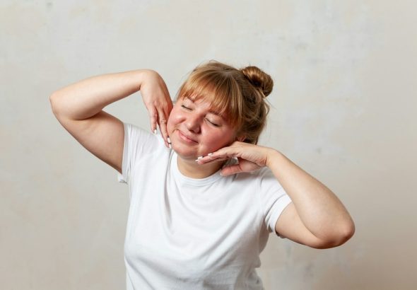 a person with the hands on the face