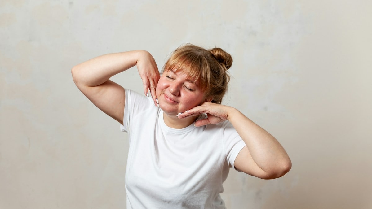 a person with the hands on the face